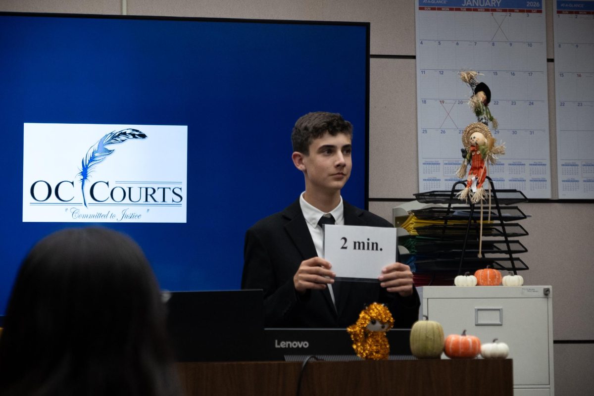 Aiden Van Dyke (‘29) introduces himself, and his roles as clerk, to the court. Court clerks track the allotted amount of time each team is allowed, and report time discrepancies between the official and unofficial clerk to the court. Though real trials do involve court clerks, limiting trial time is a rule unique to mock trials.