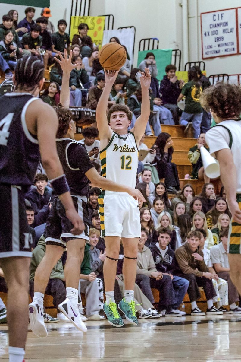 Severson pulls up for one of his nine three-point attempts. The Wildcats were knocked down 15 of their 41 attempts on the night. 