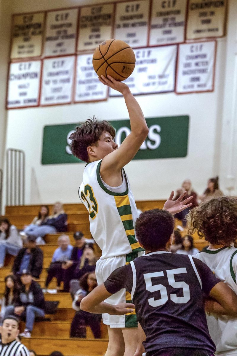 Chang elevates for a one-handed floater in the lane for two of his four points.