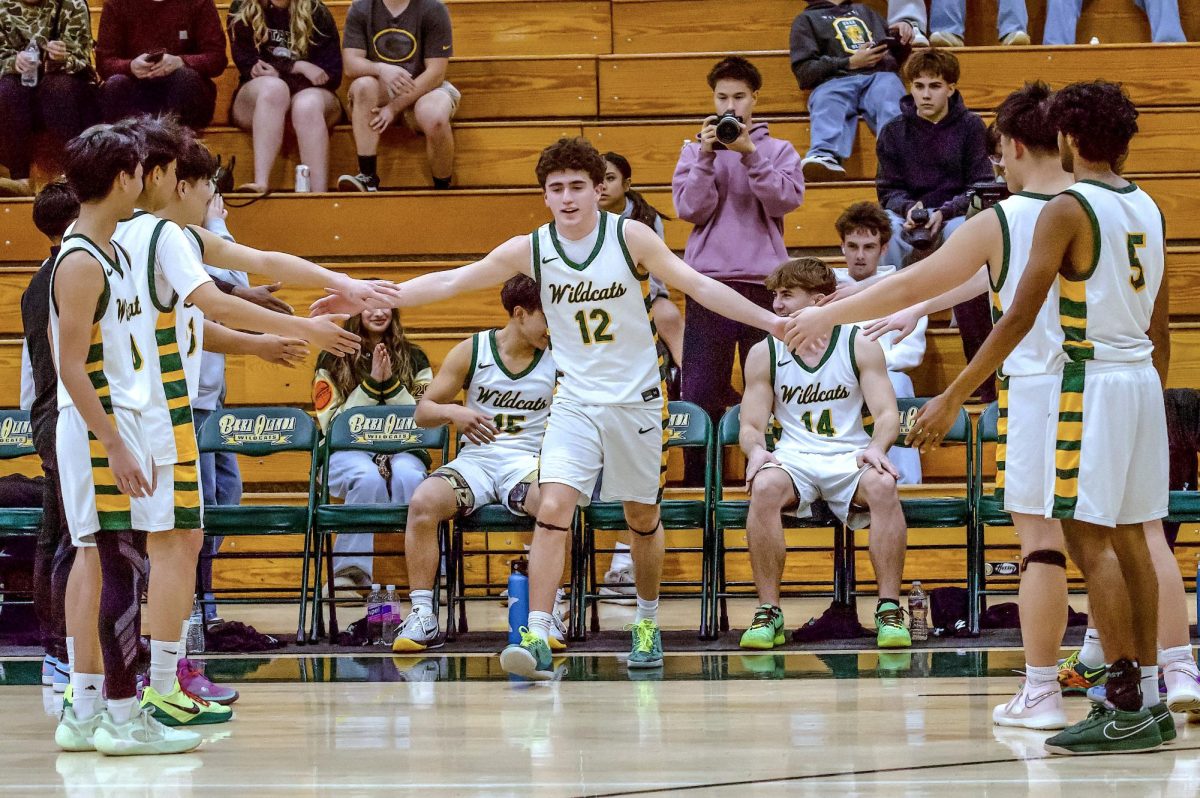 Logan Severson ('26) during pre-game introductions. The senior forward had 11 points, including three three-pointers.