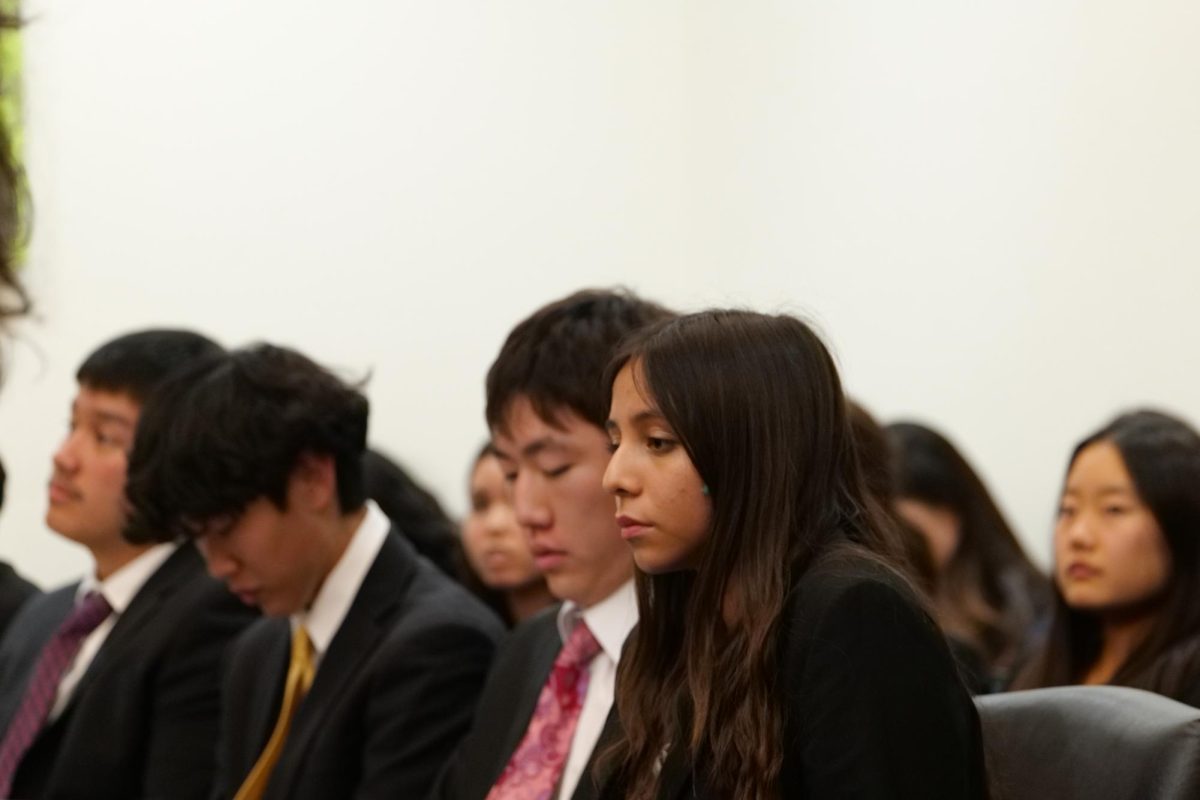 From left to right, defense attorneys Luke Oh ('26), Ryan Kim ('26), and Elena Vasquez ('28) prepare to defend the fictional case of People v. Fromholz, Dec. 4.
