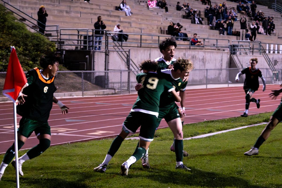 Jens Erxleben (‘27), Tyler Ho Hung (‘27), and Jonas Pearson (‘26) celebrate near the corner flag after Pearson’s goal tied the match 1–1 ten minutes into the second half.
