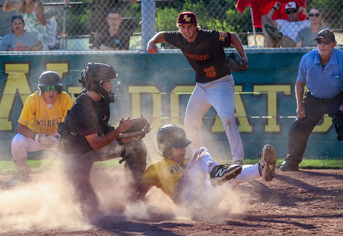 Owen Palamino slides into home plate on the final play of the game in an attempt to score the tying run, but was ruled out. The Wildcats fell to the visiting Vanguards, 3-2, evening their Freeway League record to 1-1. 