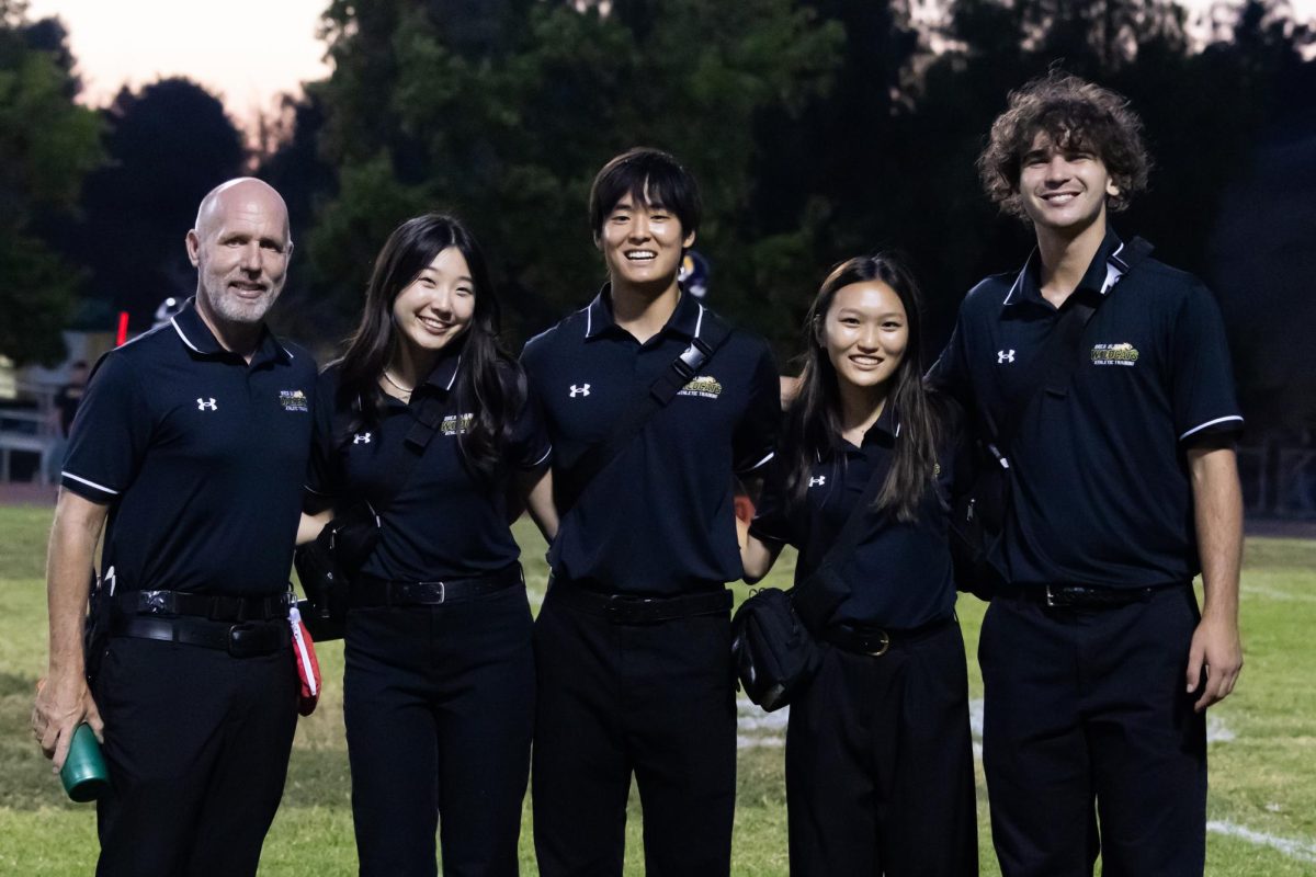 From left to right: athletic trainer Ken McCall, athletic training interns Christine Kim ('26), Beckman Giang ('27), Emma Kim ('28), and Ivan Haluska ('26). 