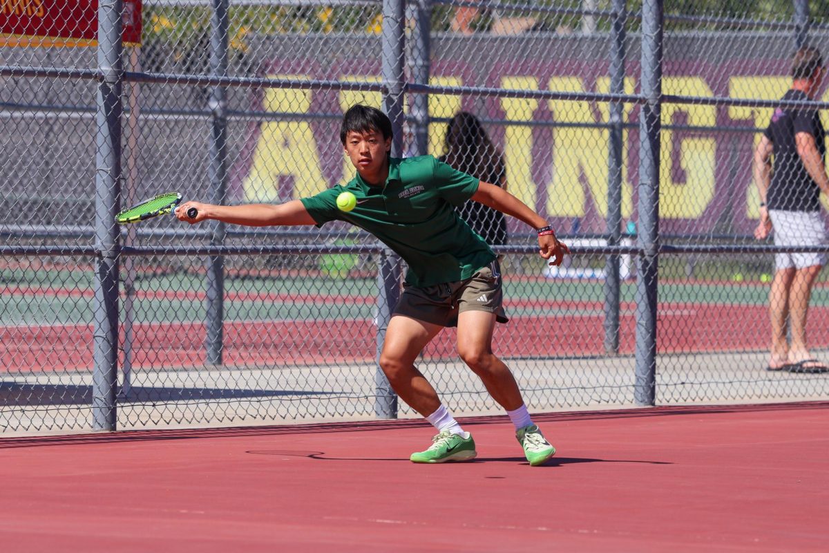 1 Nathan An ('28) locks eyes on a low ball, prepares to return.